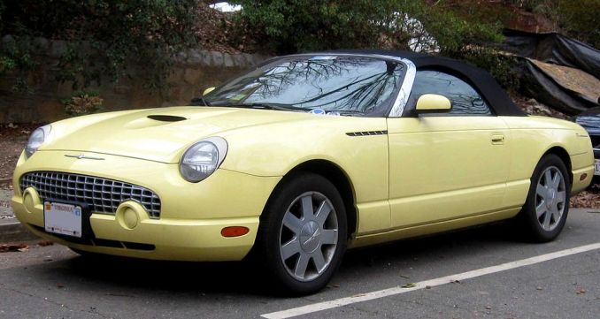 11th-generation Ford Thunderbird convertible, yellow with black soft-tip